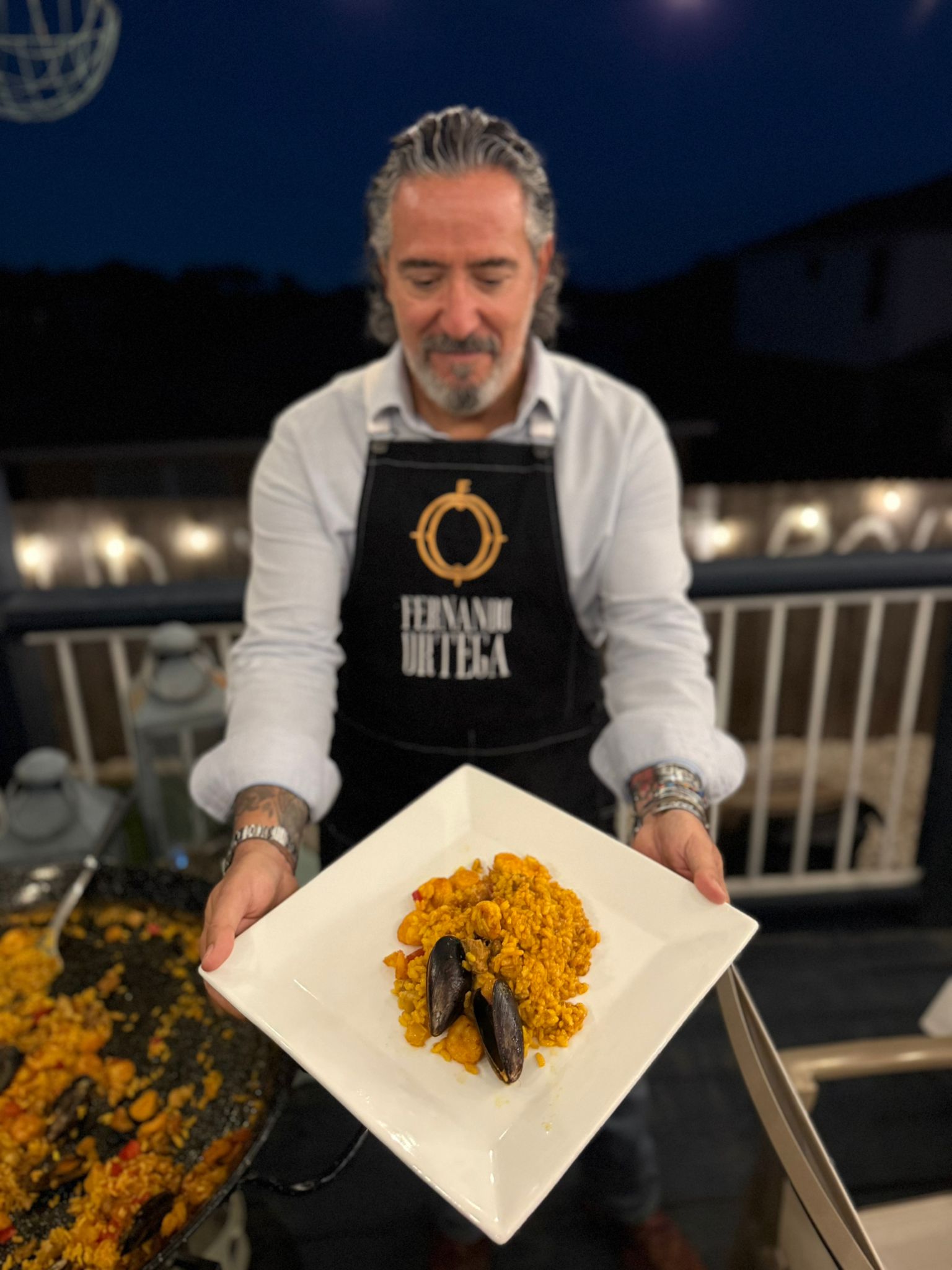Chef Fernando Ortega presenting Spanish paella